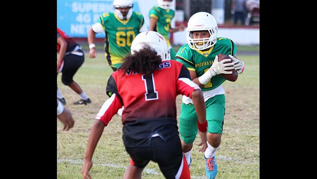 Misa Paiau of the JPS Lions is greeted by Vaouli of the JPS Vikings