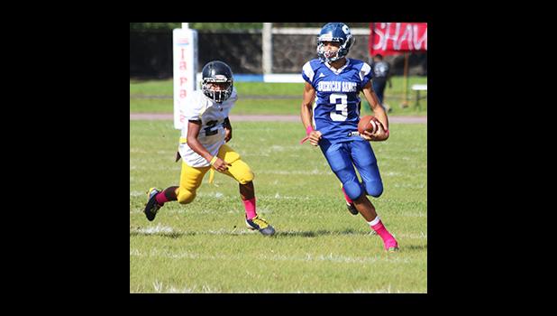 Player of the Game JV Jurgen Krusen, of Samoana High School storming towards the sidelines to take this one to the end zone – Krusen scored three touchdowns for Samoana in their 36 - 20 win over the Wildcats last Saturday. [photo: TG]