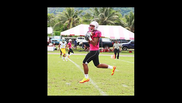 Vito Kitiona of Faga’itua in the air while he secured this catch – and took it into the end zone for the opening touchdown of their varsity game last Saturday. Kitiona helped the Vikings in their 28 - 12 victory over the Leone Lions.  [photo: TG]