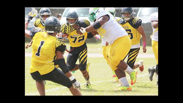 Leone Lions defensive lineman immediately apprehending Nu’uuli’s ball carrier in the backfield (end zone) for a safety in the first half of their varsity game last Saturday. The game was a tie 20 - 20. [photo: TG]
