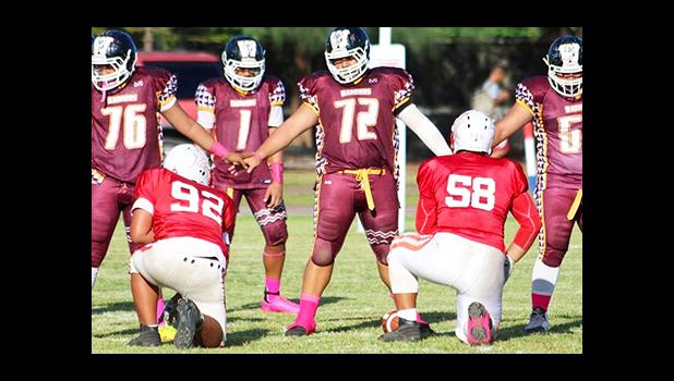 Tafuna Warriors offensive line setting up against the Vikings defense — in the first half of the Junior Varsity match up last Friday evening. Tafuna won the game 18- 14. [photo: TG]