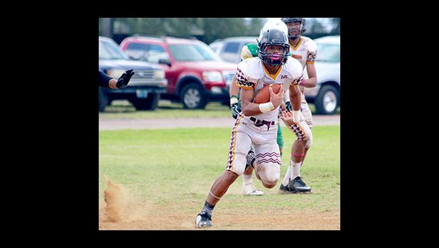 Tafuna Warriors Niles Tuamoheloa, storming towards the end zone to punch this one in for six in the opening half of their varsity game against Leone last Saturday.  [photo: TG]