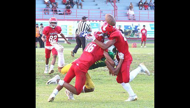 Two Faga’itua Viking defenders break up a pass