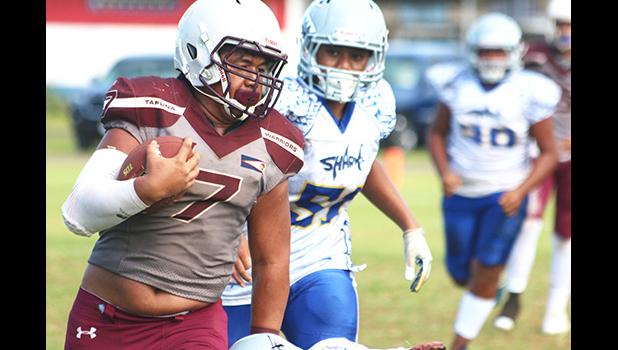 Tafuna Warriors ball carrier at the sidelines and