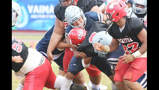 Samoana Sharks defensive captain, Masaichi Aviu breaks to the backfield and sacks Fitu Amata