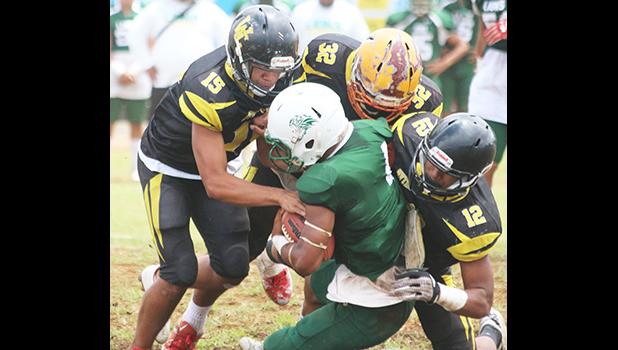 Leone Lions’ Joshua Taani being swallowed in the backfield by