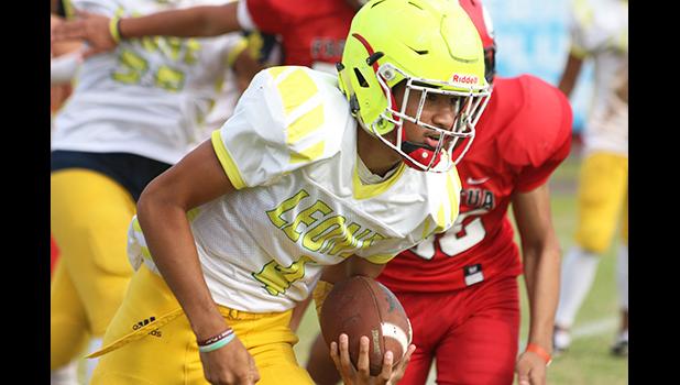 Oakland ‘Oakie’ Salave’a scrambling to take this one for a huge Lions first down during the first quarter of their JV match up against the Vikings. 
