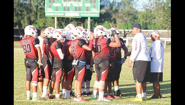 Coaches Jimmy Grey and Meafou Sagapolutele of the JPS Vikings speaking to their players