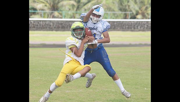 A Leone Lions receiver tries to gain control of the ball while defending was Prodieus Lutu-Fuga of the Sharks