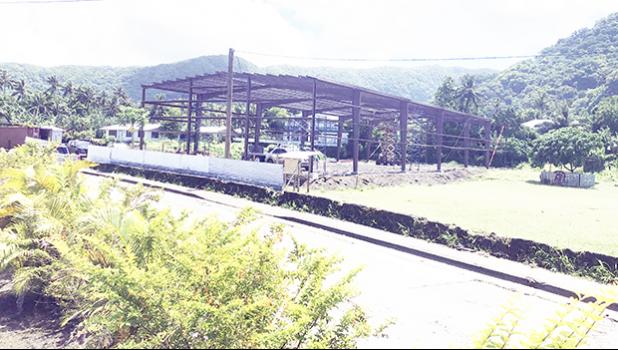 frame of new warehouse in a field