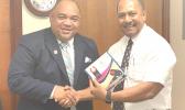 Faipule Tapai Ala’ilepule Benjamin Vaivao hands over devices