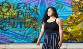 Leah McKenzie, of Long Beach standing before the mural.