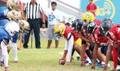  The Red All-Star team’s offensive unit setting up to snap off against the Blue All-Star team’s vicious  first half defense. [photo: TG]