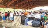 Some of the STP workers who have been laid off, packing all their belongings and things first to take to Samoa. Tickets for the ferry Lady Naomi were sold out, but Polynesian Shipping made it possible for the STP  and StarKist Samoa workers to have first priority to leave on Thursday.  [Photo: Ese Malala]