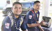 Two young men at bus stop