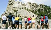 n this July 21, 2005 file photo, visitors watch while workers pressure wash the granite faces of George Washington, left, Thomas Jefferson, Theodore Roosevelt and Abraham Lincoln at Mount Rushmore National Memorial in South Dakota. The Democracy Index, compiled by the London-based Economist Intelligence Unit, ranked the U.S. at 21st worldwide in 2016, tied with Italy and trailing Norway, Canada and Uruguay, among others. While Norway and several other Scandinavian countries are considered "full democracies," according to the index, the U.S. last year fell to "flawed democracy," receiving low scores for "functioning of government" and "political participation." (AP Photo/Charlie Riedel, File) n this July 21, 2005 file photo, visitors watch while workers pressure wash the granite faces of George Washington, left, Thomas Jefferson, Theodore Roosevelt and Abraham Lincoln at Mount Rushmore National Memorial in South Dakota. The Democracy Index, compiled by the London-based Economist Intelligence Unit, ranked the U.S. at 21st worldwide in 2016, tied with Italy and trailing Norway, Canada and Uruguay, among others. While Norway and several other Scandinavian countries are considered "full democracies,
