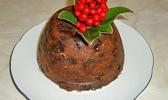 Christmas steamed pudding on a white plate