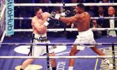 CARDIFF, WALES - MARCH 31: Anthony Joshua and Joseph Parker exchange punches during there WBA, IBF, WBO & IBO Heavyweight Championship title fight at Principality Stadium on March 31, 2018 [photo via NZ Herald]