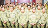 More than 30 members of an American Samoa family pose for pictures Nov. 8 at Thompson Hall. The Soldiers are advanced individual training students and most are enrolled in the Unit Supply Specialist Course taught by the Quartermaster School. In all,, there are 41 members of the same Samoan family training at Fort Lee. [Photo: Terrance Bell]