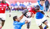 Neria Fomai #6 and Laaloi Leilua #7 of Samoa combine to bring down Andrew Amonde #8 of Kenya during the Trophy Cup Final match between Kenya and Samoa at the HSBC Rugby Sevens Series held in Sam Boyd Stadium March 3-5, 2017. Final score: Kenya- 21, Samoa-14. (Photo by Allan Hamilton/ Calibre Sports Photomedia)