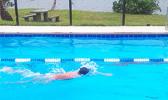 PHS high school student works to perfect his freestyle stroke.