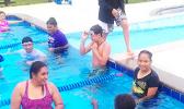 PHS's high school swimming class with instructor, Debbs Cox