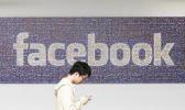 In this June 11, 2014, file photo, a man walks past a Facebook sign in an office on the Facebook campus in Menlo Park, Calif. Facebook announced Thursday, April 6, 2017, it is launching a tool to help users spot false news articles on the site. The tool, similar to others around privacy and security, will be available to users in 14 countries, including the U.S. Users will see it for a few days when they open Facebook. (AP Photo/Jeff Chiu, File) In this June 11, 2014, file photo, a man walks past a Facebook sign in an office on the Facebook campus in Menlo Park, Calif. Facebook announced Thursday, April 6, 2017, it is launching a tool to help users spot false news articles on the site. The tool, similar to others around privacy and security, will be available to users in 14 countries, including the U.S. Users will see it for a few days when they open Facebook. (AP Photo/Jeff Chiu, File)