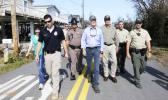 Gov. Rick Scott, center, assess the damages in the aftermath of Hurricane Irma, Wednesday, Sept. 13, 2017, in Big Pine Key, Fla. (AP Photo/Alan Diaz) Gov. Rick Scott, center, assess the damages in the aftermath of Hurricane Irma, Wednesday, Sept. 13, 2017, in Big Pine Key, Fla. (AP Photo/Alan Diaz)