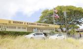 This Tuesday, July 11, 2017 photo shows the front office of Kaiser High School in Honolulu. Army Sgt. 1st Class Ikaika Kang graduated from the school in 2001. Those who know him said they're shocked to hear about terrorism charges against him after authorities said he pledged allegiance to the Islamic State group. (AP Photo/Jennifer Sinco Kelleher) This Tuesday, July 11, 2017 photo shows the front office of Kaiser High School in Honolulu. Army Sgt. 1st Class Ikaika Kang graduated from the school in 2001. Those who know him said they're shocked to hear about terrorism charges against him after authorities said he pledged allegiance to the Islamic State group. (AP Photo/Jennifer Sinco Kelleher)
