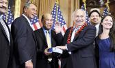 In this Jan. 5, 2011 file photo, House Speaker John Boehner, second left, of Ohio participates in a ceremonial House swearing-in ceremony for Del. Eni H. Faleomavaega, third from right, D-American Samoa, on Capitol Hill in Washington. American Samoa’s longest serving non-voting delegate to the U.S House of Representatives Faleomavaega died Wednesday, Feb. 22, 2017, at age 73. [AP Photo/Susan Walsh, File]
