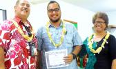 Derek Helsham (center), chairperson of the ASCC Health & Human Services Department, receivimng an award from Vice President Dr. Lina Scanlan, and Agriculture, Community and Natural Resources/Land Grant Director Aufa’i Ropeti Apulu Areta during the College’s Faculty Awards ceremony held at the beginning of the current semester.  [photo: J. Kneubuhl]