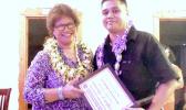 At last week's Graduate Banquet, newly-appointed ASCC Vice President of Academic and Student Affairs Dr. Lena Galea'i Scanlan (left) presents a Teacher Education Department award to Ms. Katerina Joita Ameperosa, who has completed her Bachelor of Education - Elementary Education degree.  [Photo: J. Kneubuhl]