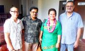 Following her guest speech at an ASCC faculty conovocation, DOE Director Dr. Ruth Matagi-Tofiga (second right) took a moment to chat with (l-r) student Ulelemaikalani Nate Kwon, science instructor Gopalan Murali and automotive instructor Fred Suisala.  [Photo: J. Kneubuhl]