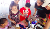ASCC Marine Science student interns Claudia Thompson and Naomi Matagi teach local youth about fish anatomy and ecology through fish prints at the recent STEM Summit at Samoana High School.  [Courtesy Photo]