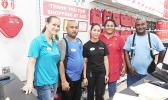 Some of the Neil’s ACE Home Center employees working hard yesterday morning who still managed to smile for the Samoa News camera.  [Photo: EM] 
