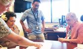 Amata discusses veterans’ health services and planning with Director Jennifer Gutowski in a visit to Tripler Center in Honolulu.  [courtesy photo]