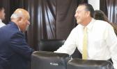 President/CEO of Haleck Enterprises Inc., Avamua Dave Haleck (right) shaking hands with Sen. Fa’amausili Mau Mau Jr., after testifying last Thursday before a Senate committee on three administration revenue measures.  [photo: FS]