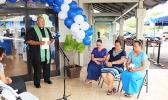 Father Vaiula Kolio blessing the newly renovated Bluesky Communications store at the Laufou Shopping Center, yesterday morning. The inside of the store was ‘blessed’ with Holy Water — which the Catholic priest said, “With the intention that all will be good in the name of our Lord.”  [photo: TG]