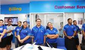Bluesky Communication employees awaiting the end of the dedication ceremony to officially open their newly renovated store inside the Laufou Shopping Center yesterday morning. [photo: TG]