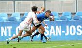 Darren Kellet Moore busts thru two England 7s players to score the second try for Manu Samoa, at the SiliconValley 7s, San Jose, California, USA.  [Photo: Barry Markowitz]