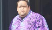 Elijah Jared Tavai exits the front door of the District Court yesterday morning after his initial appearance on 3 criminal charges — child abuse, patronizing prostitution, and endangering the welfare of a child — stemming from an alleged incident involving one of his male students when he was a teacher at Leone High School.  [photo: AF]