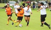 A Fa’asao-Marist Cougars player tries to dribble away from a Samoana Sharks defender in an ASHSAA Girls Soccer J-V game on Saturday, Jan. 21, 2017 at Pago Park Soccer Stadium in Pago Pago.  [FFAS MEDIA/Brian Vitolio]