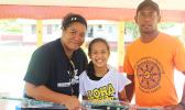 NMSAS education and outreach coordinator Isabel Gaoteote presents a fishing rod to one of the winners of this year's Tautai Fagota Fishing Derby in Vaitogi. See story for full details.  [photo: BC]