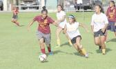 A Tafuna player, left, and Fa’asao-Marist opponent, right, in action a 2016-17 ASHSAA Girls Soccer playoff game at Pago Park Soccer Stadium on Monday, March 20, 2017.  [FFAS MEDIA/Brian Vitolio]