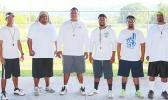 Lions coaching staff led by Head Coach Okland Salave'a (center) posing for a group photo just before practice in August 2016. [SN file photo]