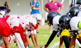 Nu’uuli Wildcats offense, moments away from snapping the ball against a hungry and vicious Faga’itua Vikings defensive front – Faga’itua played the Wildcats to record their second win of the season after a 31 - 14 victory.  [photo: TG]