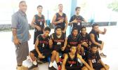 Coach Afati Afati with the Fagaitua Vikings JV Basketball team after losing against the Samoana Sharks JV on Tuesday evening.  [photo: Ese Malala]