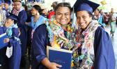 Two graduates of Kanana Fou High School smile proudly for the camera at the end of the commencement ceremony yesterday that was held at the CCCAS Taeaoafua Gymnasium. Congrats girls!   [photo:EM]