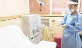 Nurse Marvin prepares the dialysis machine for a patient at the Dialysis clinic. Obesity & diabetes is the most prevalent of non-communicable diseases in the Territory and LBJ is asking patients to be pro-active — keep your appointments and live healthy.  [photo: Ese Malala]