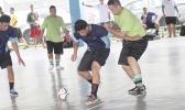 Tafuna Jets 1’s Harry Matau holds off Lion Heart B’s Charmaney Faatupuinati on Match Day 3 of the 2017 FFAS Futsal Tournament at Samoana High School’s gym in Utulei on Saturday, May 20, 2017.   [FFAS MEDIA/Brian Vitolio]